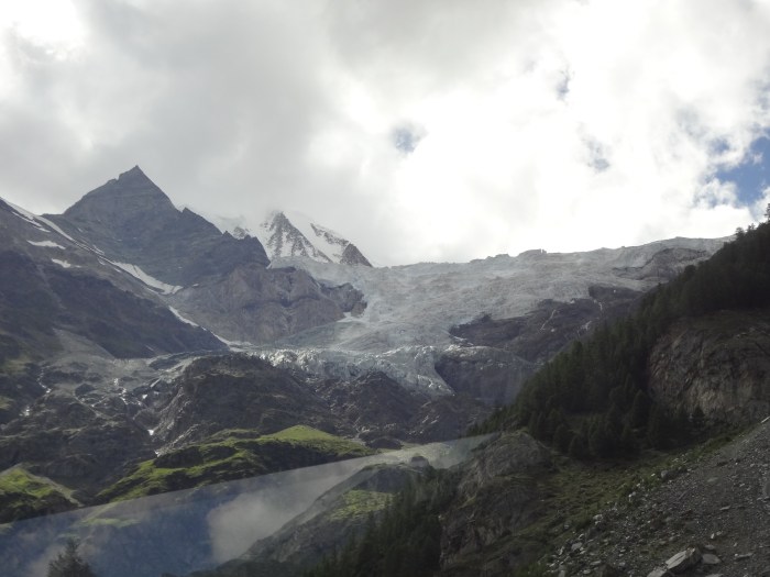 Snow covered mountain tops in the background, glacier towards the front.  The part that looks like water rushing down the mountain.  It's breathtaking! 